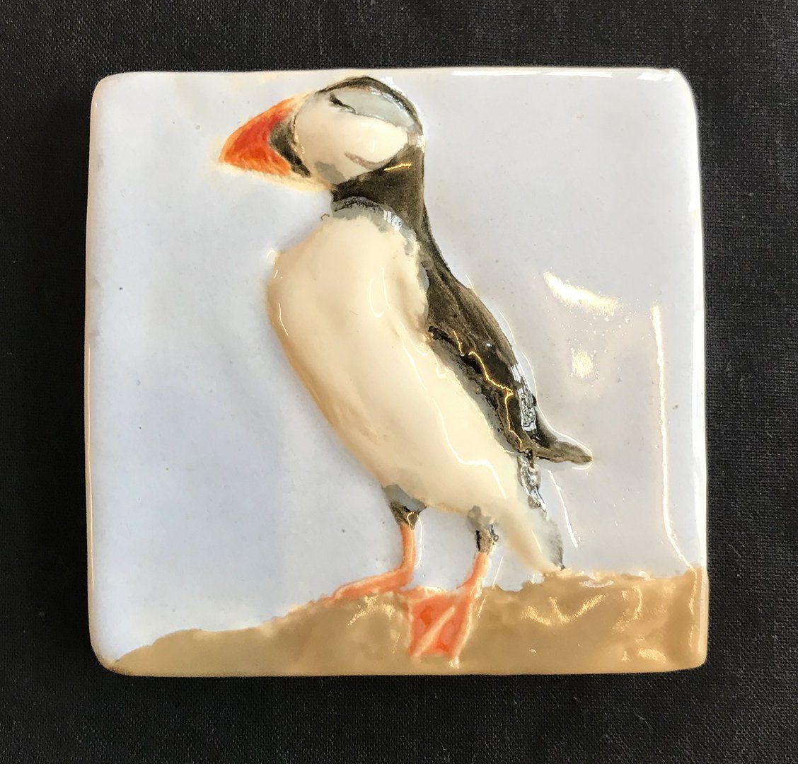 Hand made feature tile titled