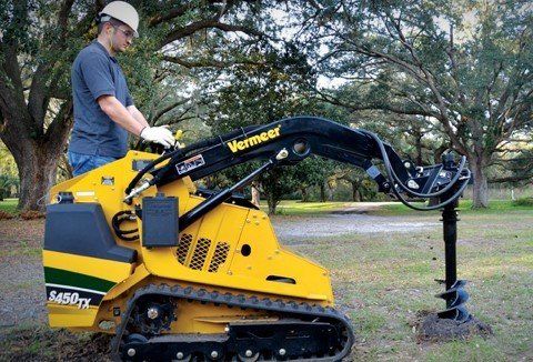 Mini Skid Steer with Auger Attachment