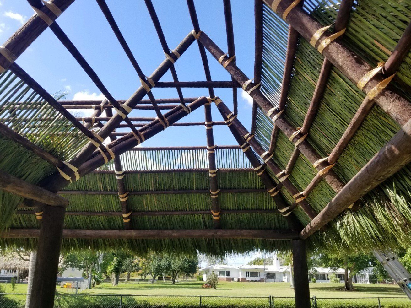 Tiki-Hut-With-Palm-Leaf-Wrap-and-Stain