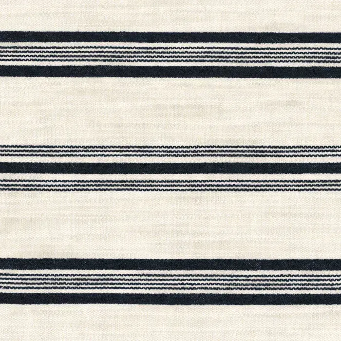 Tissu Misia blanc cassé avec de larges rayures horizontales noir carbone brodées.