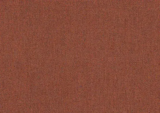 Tissu Sunbrella Heritage rouge rouille avec un tissage texturé et des nuances chinées chaleureuses.