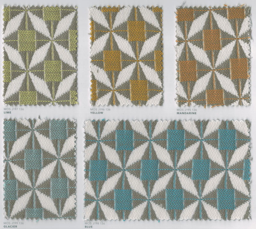 Tissus Mosaic avec des motifs étoilés géométriques colorés en vert, jaune ocre et turquoise.