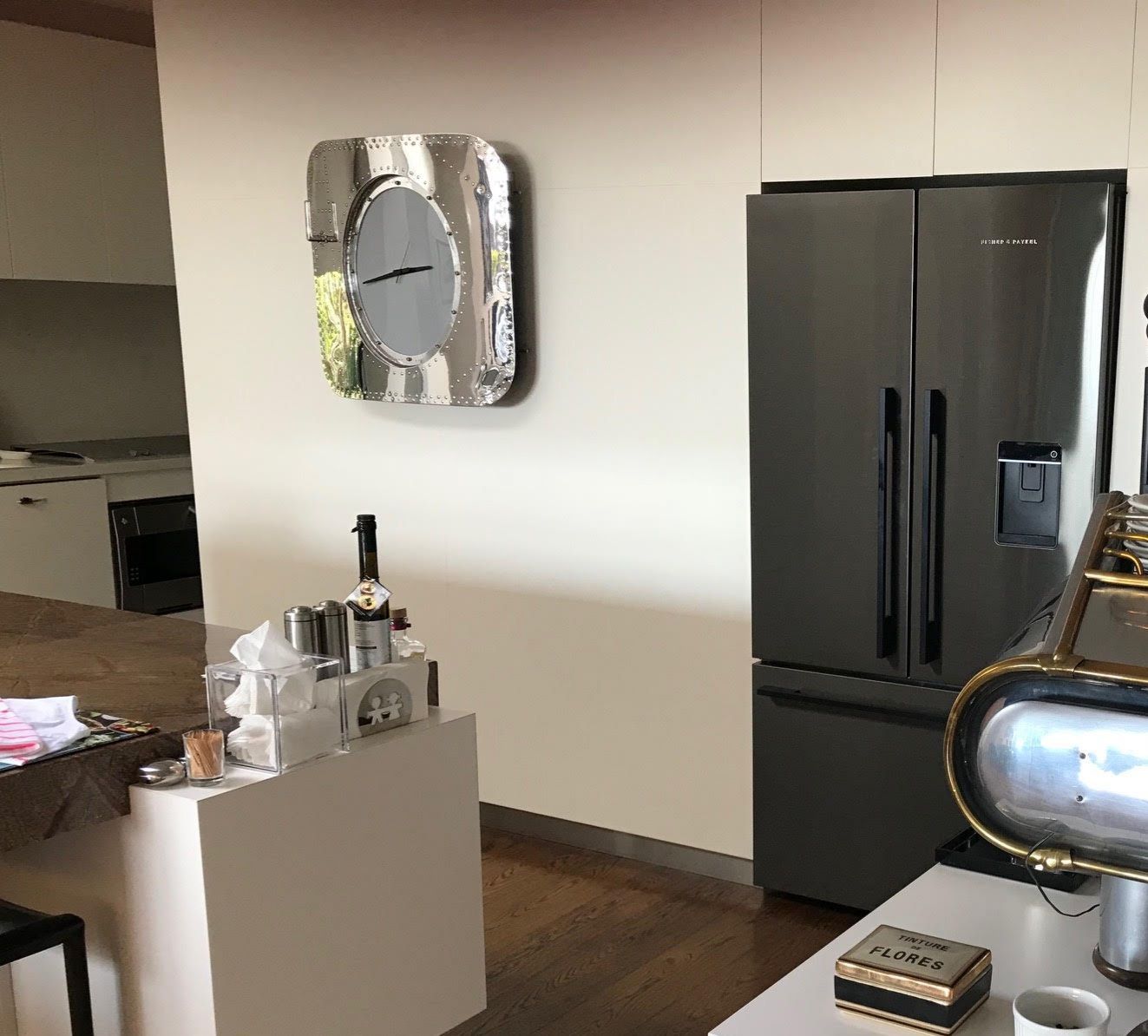 The mirror-polished aircraft panel taking pride place, mounted on a wall in a customer's kitchen.