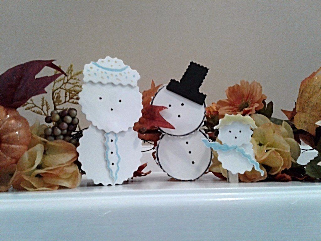 Snow family on a mantle at Kalejta Financial Management Company.