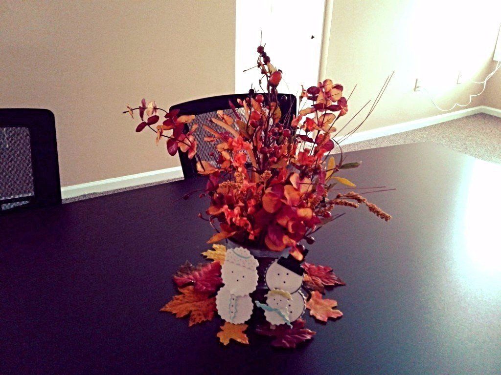 Pail with fall leaves and berries