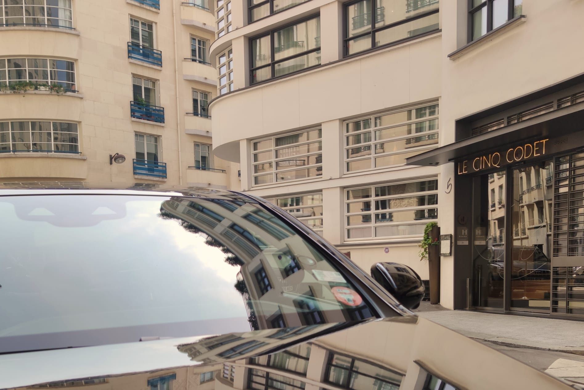 Lady seated in a chauffeur car