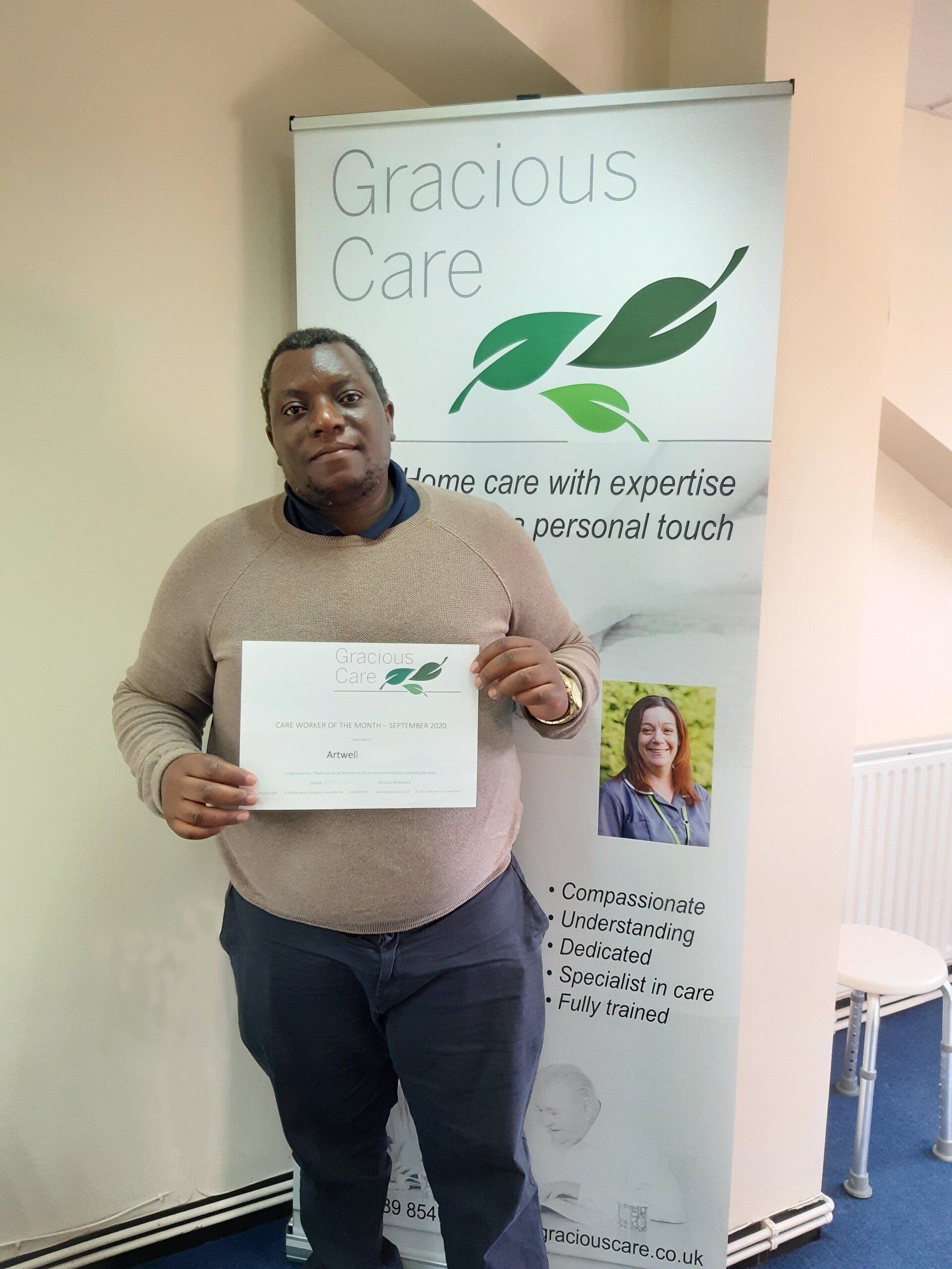 Artwell receives his certificate of appreciation