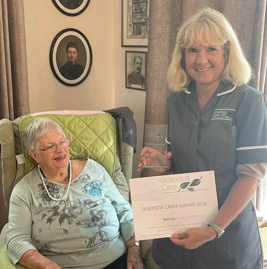 Carer presented by a customer with her 2024 Dementia Care award
