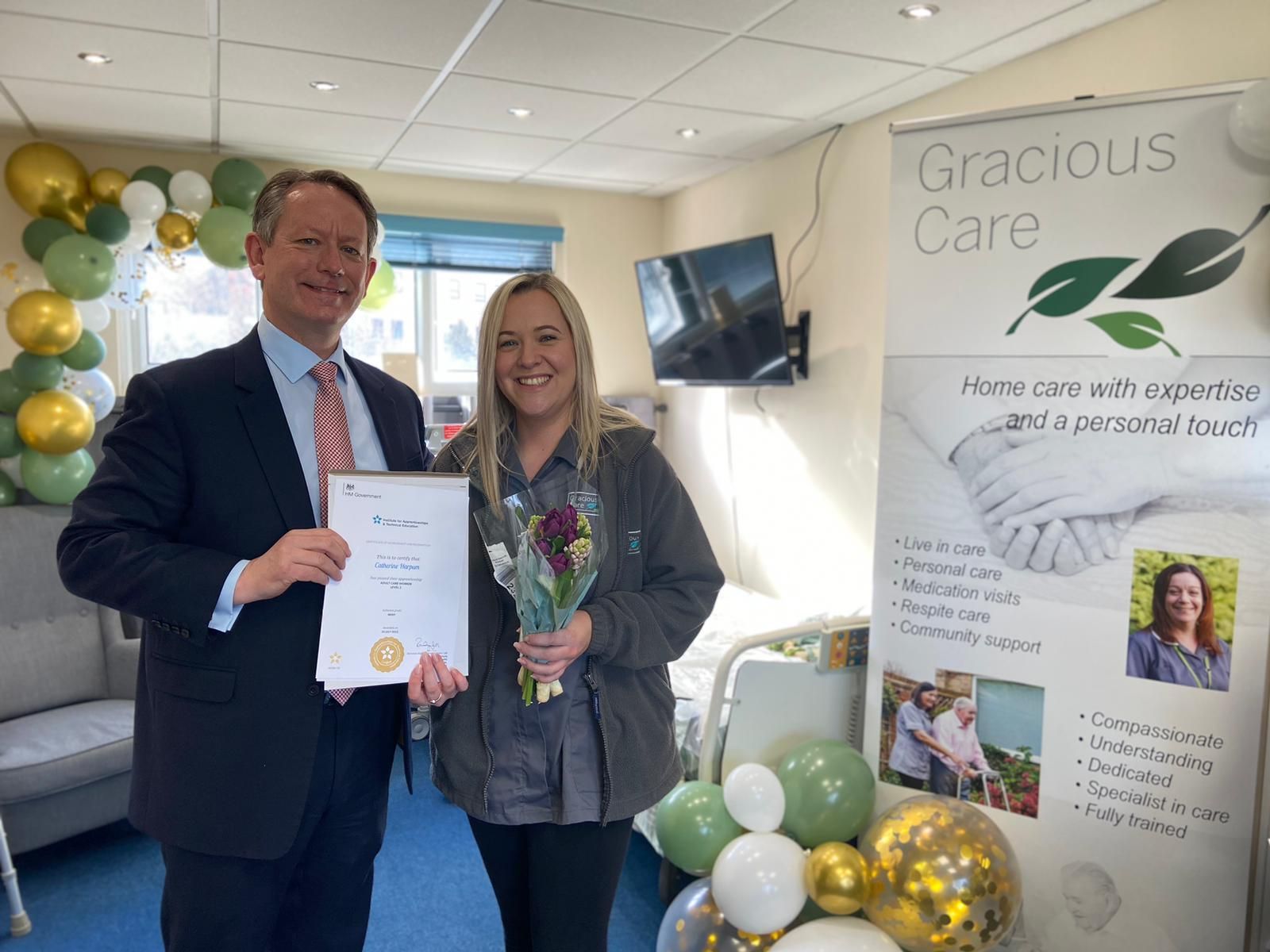 Gareth Bacon MP presenting Most Gracious Care Worker certificate