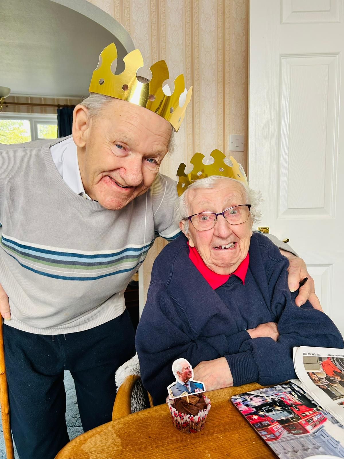 Customers and staff celebrate the coronation of King Charles III