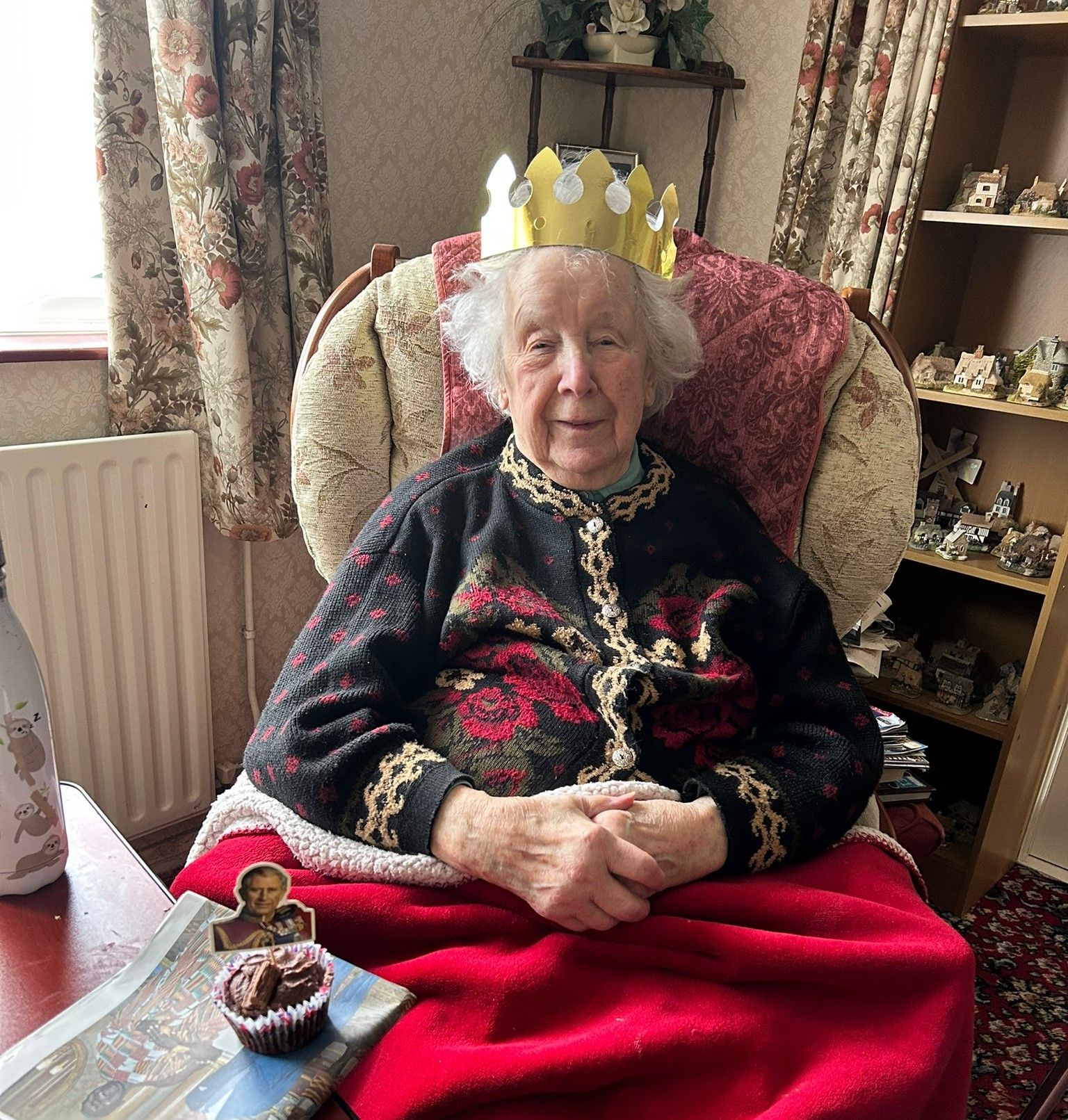 Customers and staff celebrate the coronation of King Charles III