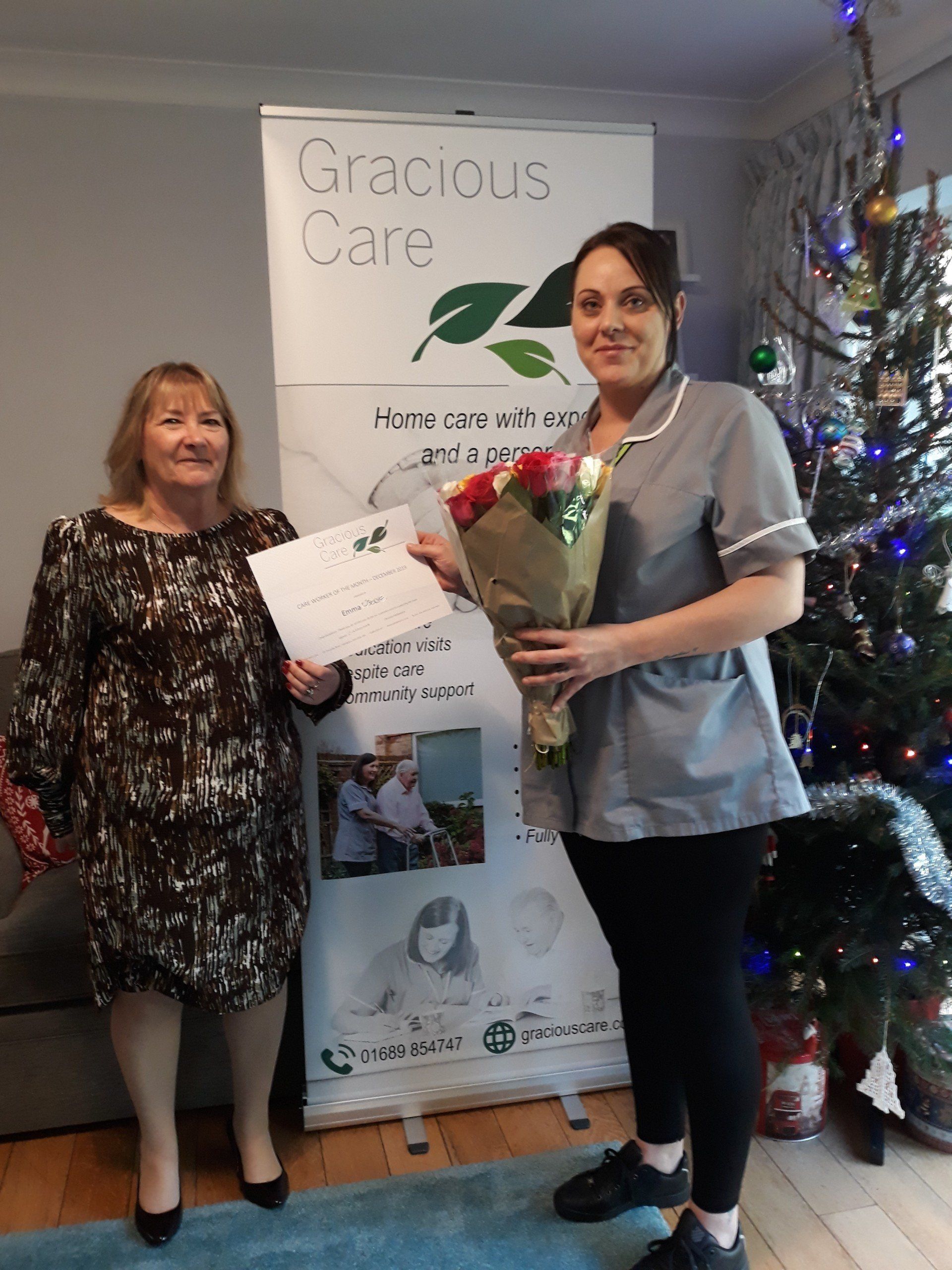 Emma presented with her certificate by Christine