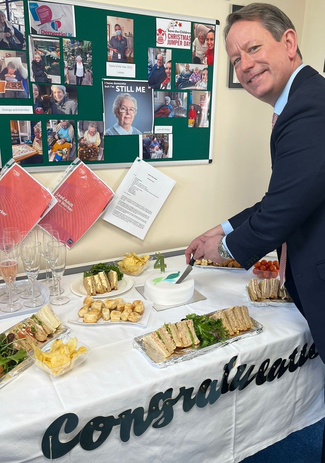 Gareth Bacon MP cutting our 4th Year celebration cake