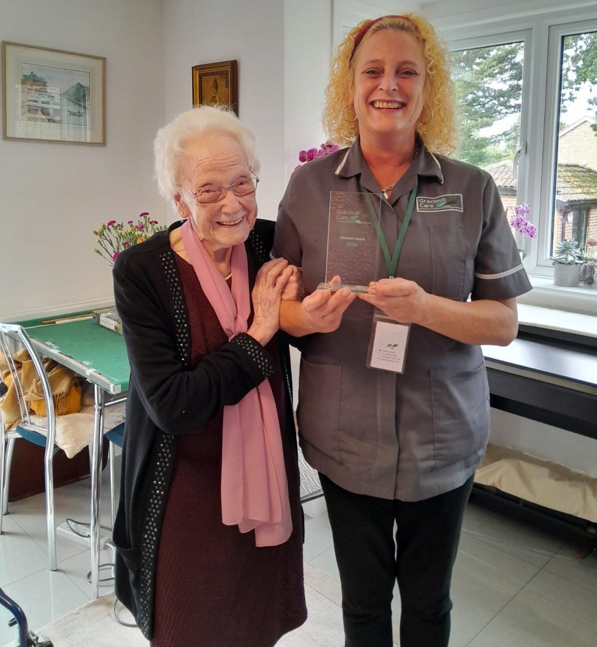 Carer presented by a customer with her 2024 Directors award