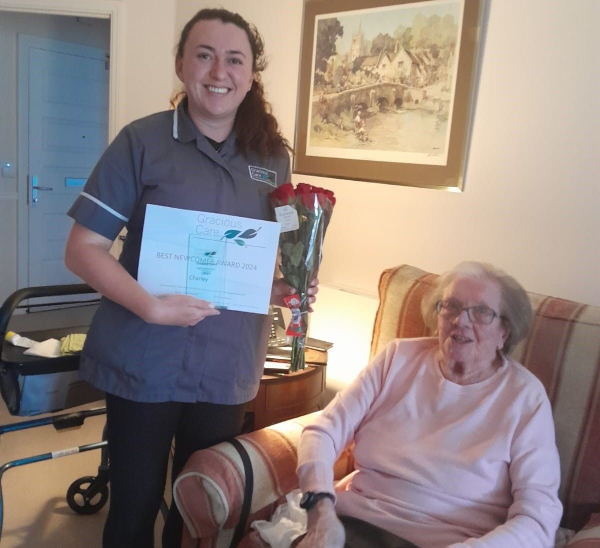 Charley receives her Newcomer of the Year award from one of her customers
