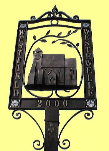 Westfield Village Sign. Depicts the church and shows the modern and Saxon name (Westewelle)