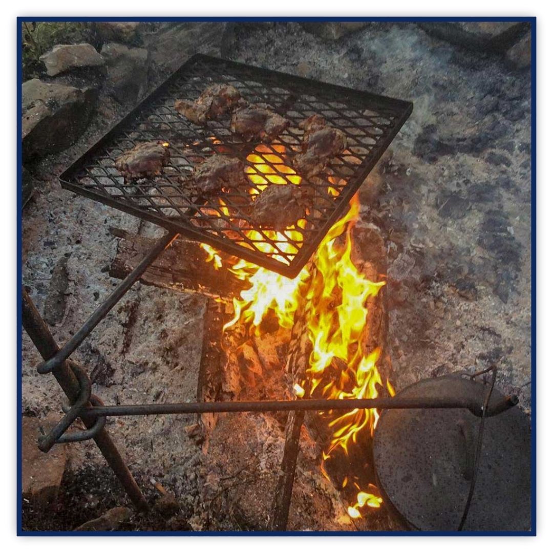 A close-up of the durable, American-made steel construction of an outdoor campfire grill grate.