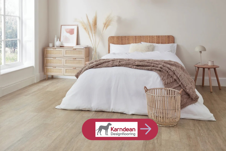 Karndean oak look flooring in a bedroom with a bed, white quilt, white wicker furniture