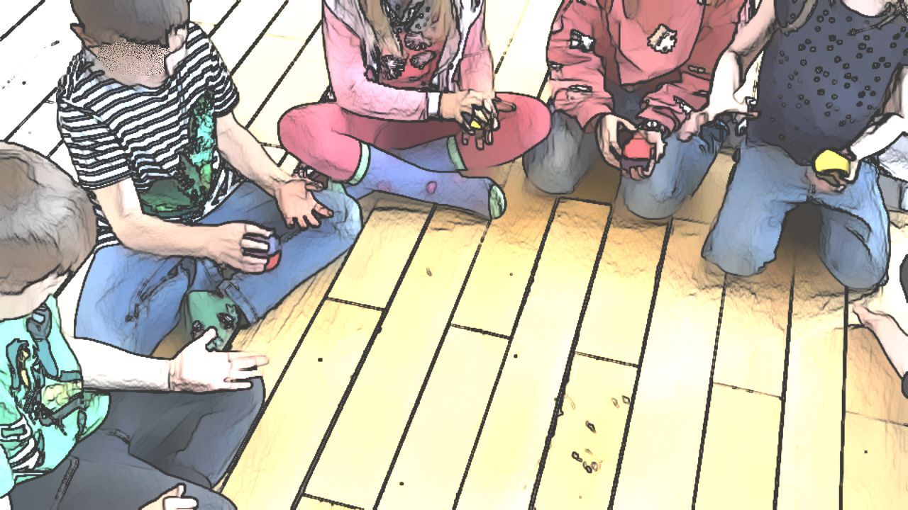 Kinder geben einen Ball in einem Rhythmusspiel weiter