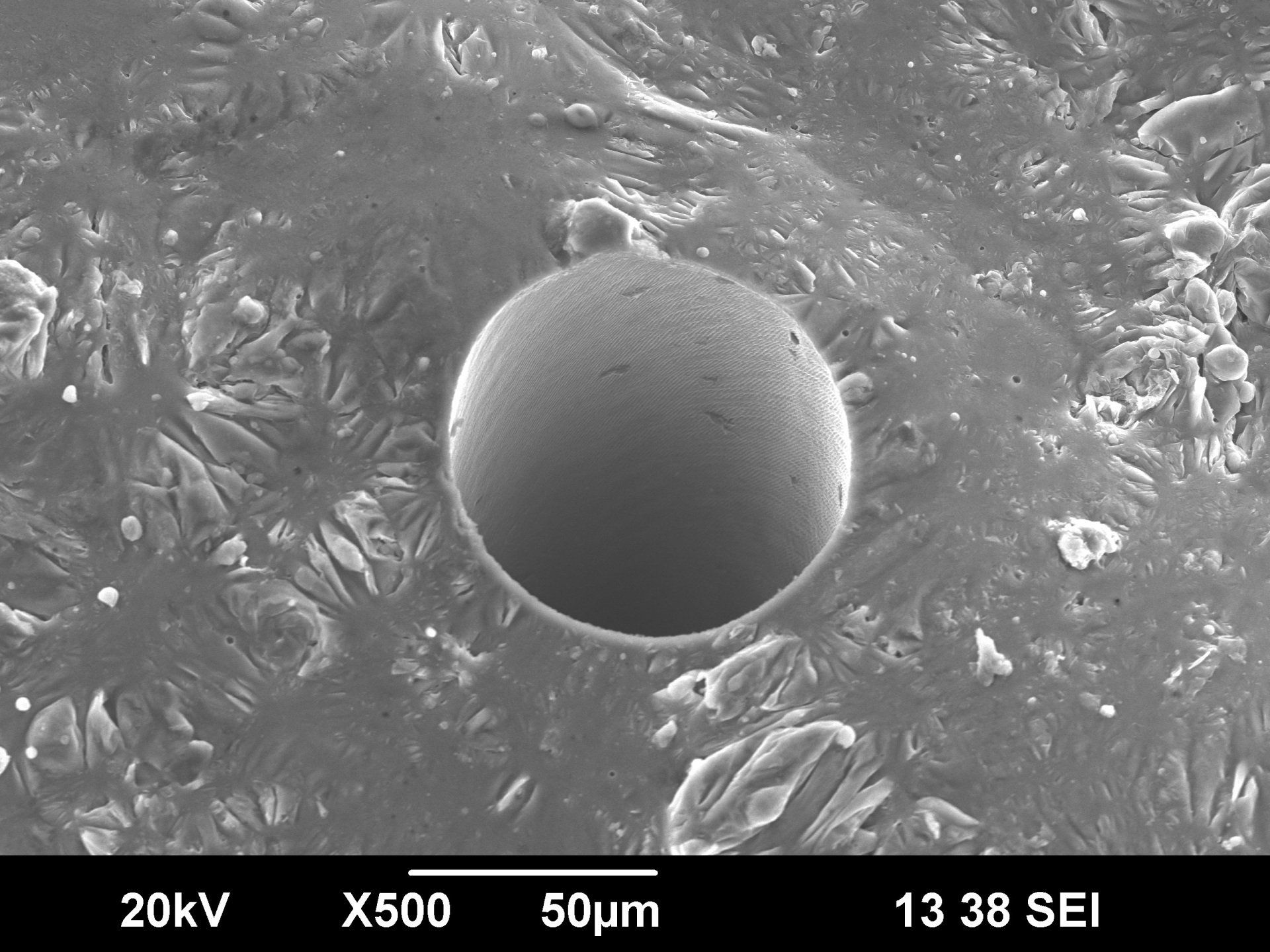 Laser micro-drilled hole in additive manufactured aluminum