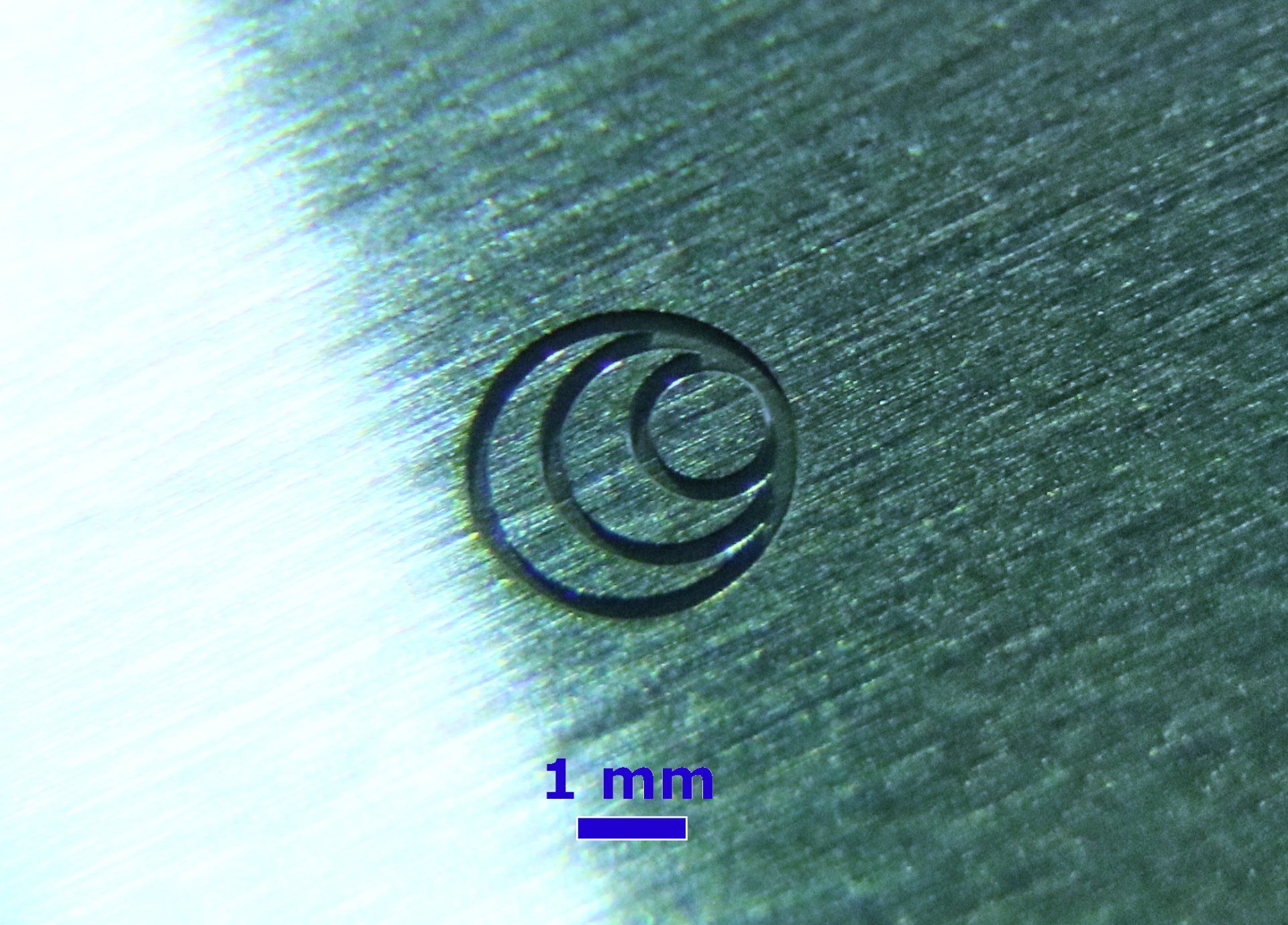 Microscopic view of a laser generated micro engraving