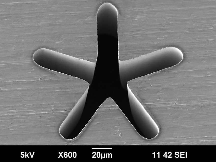 Star-shaped hole drilled with an ultrafast laser