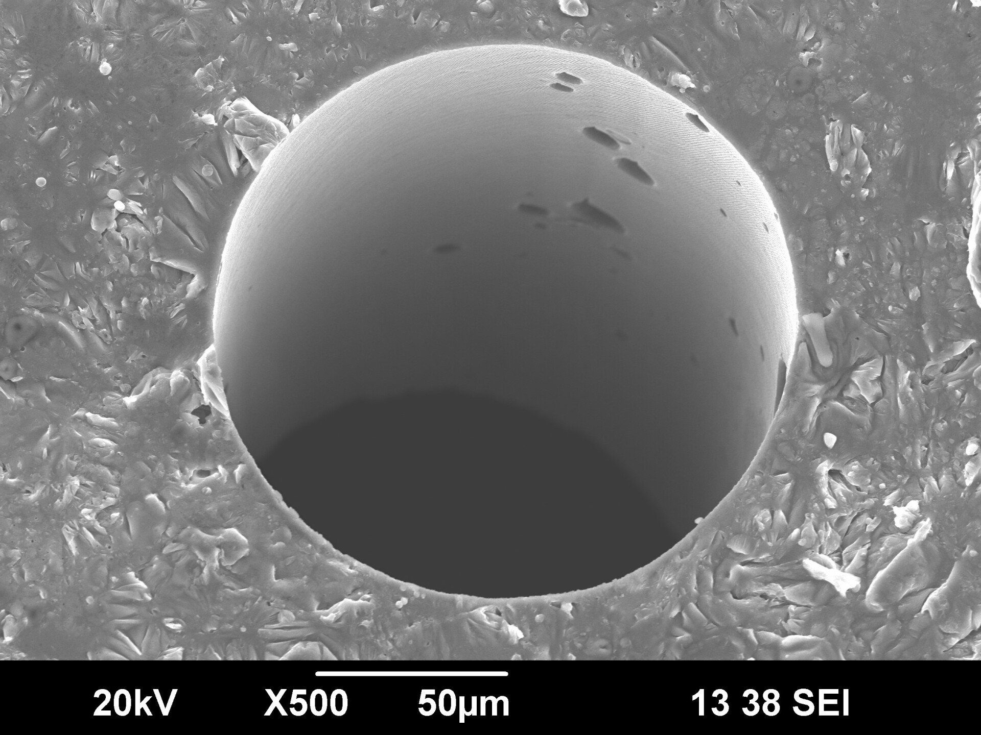 Exit of microhole in additive manufactured aluminum