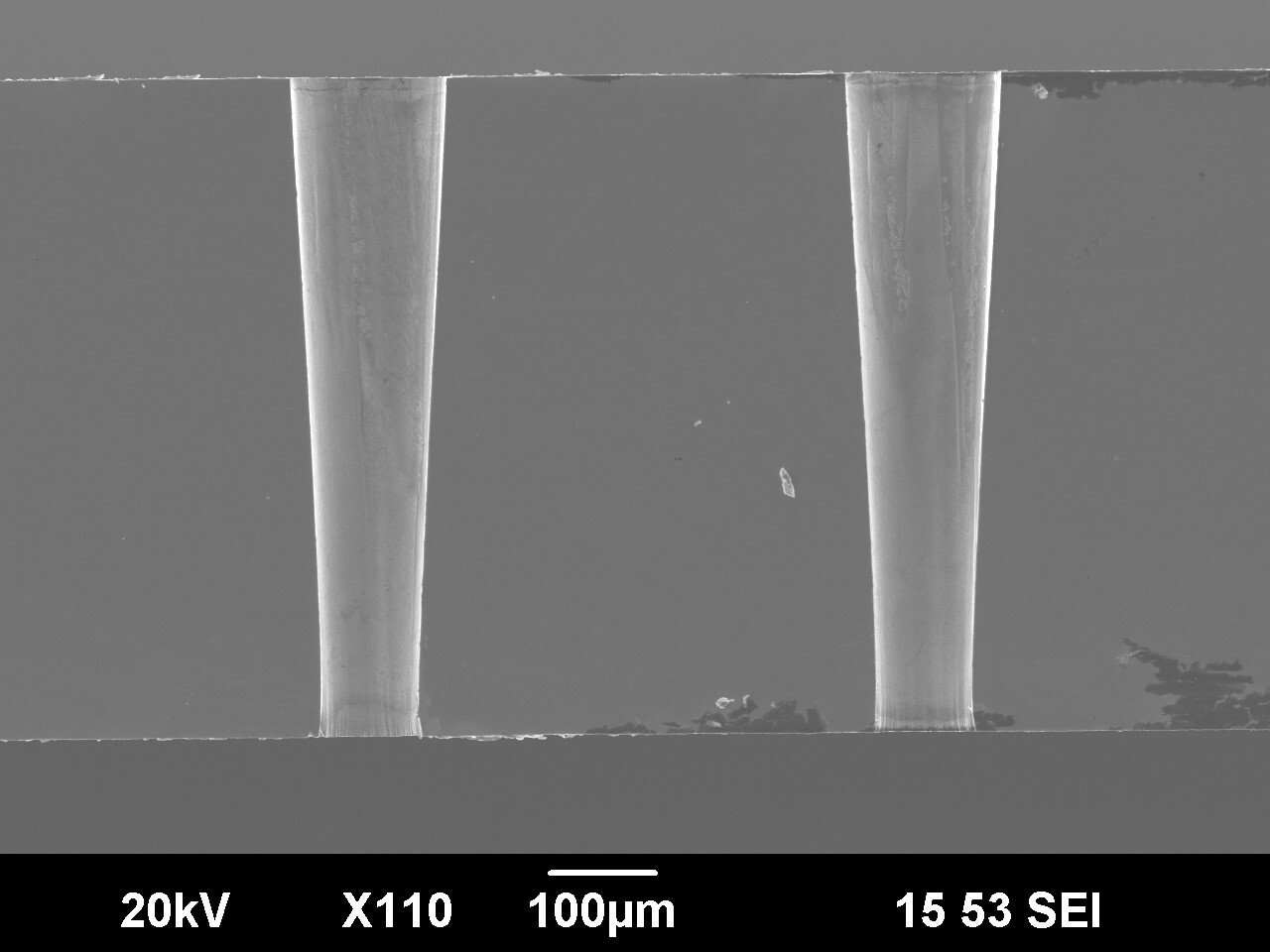 Cross-sections of conical shaped micro holes drilled with an ultrashort pulse laser