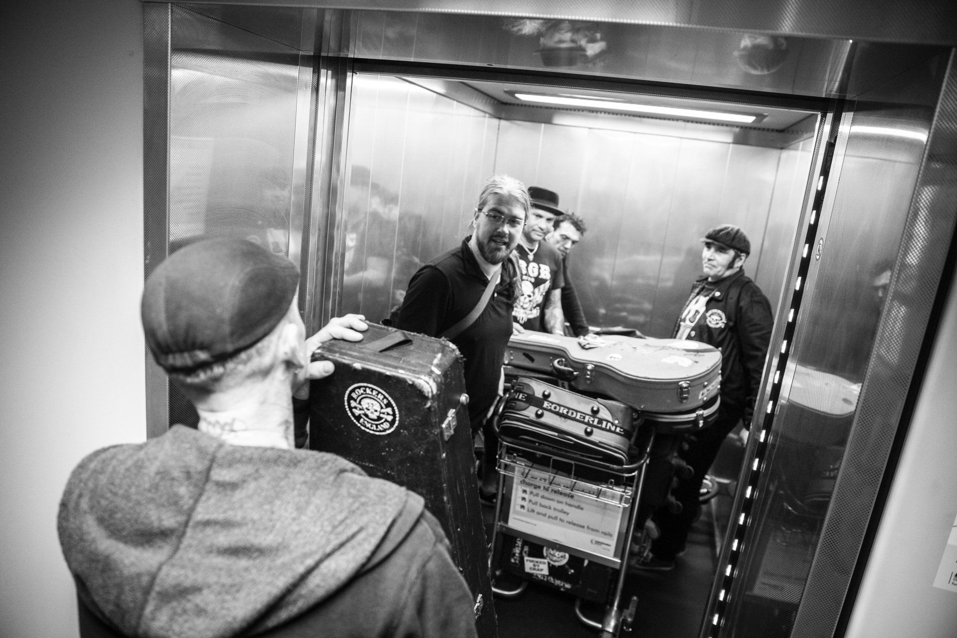 http://www.gcdphotography.com Four chaps in a lift with a startled onlooker