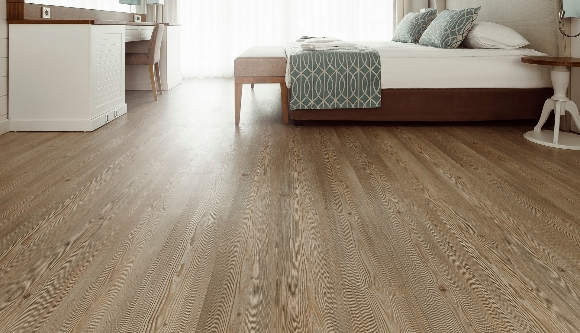 Stunning new LVP flooring installation by Floors Plus, featuring rich dark wood tones and wide plank