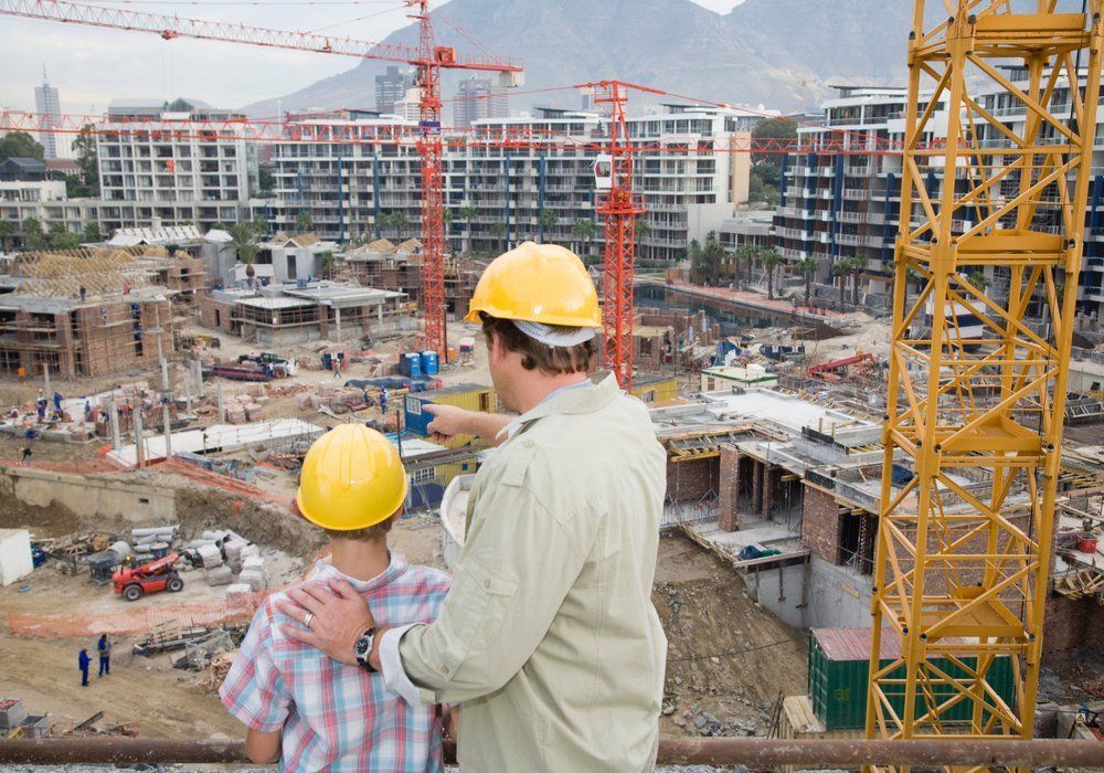 Man showing boy building site