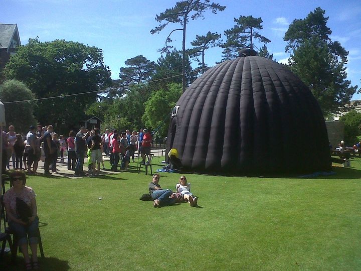 Science Dome UK planetarium at Bournemouth Gardens set up for outdoor event.