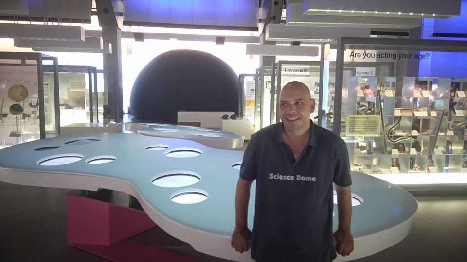 Presenter of the Science Dome UK at Science Museum in London with planetarium behind.