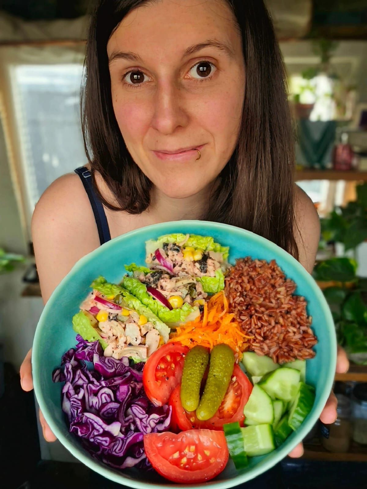 Rose holding a bowl of tuna mayo salad with red rice