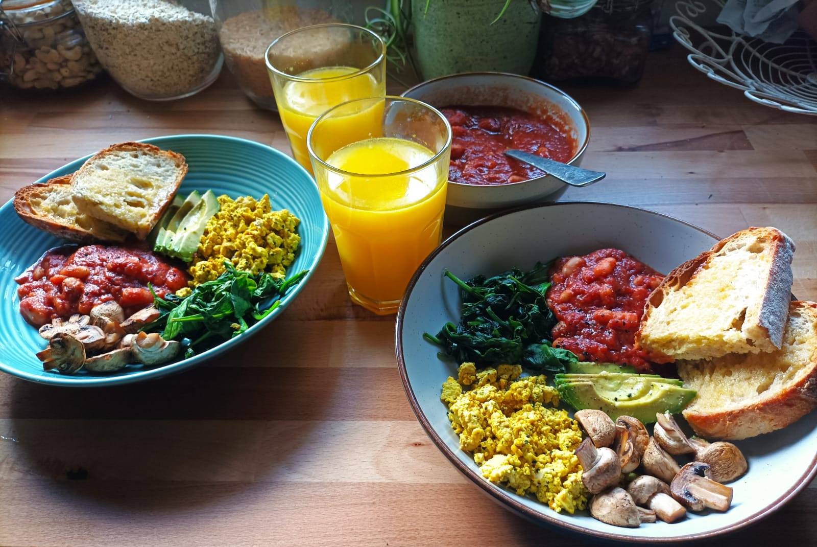 A Cooked Breakfast with beans, tofu scramble, toast, mushrooms, avocado and spinach