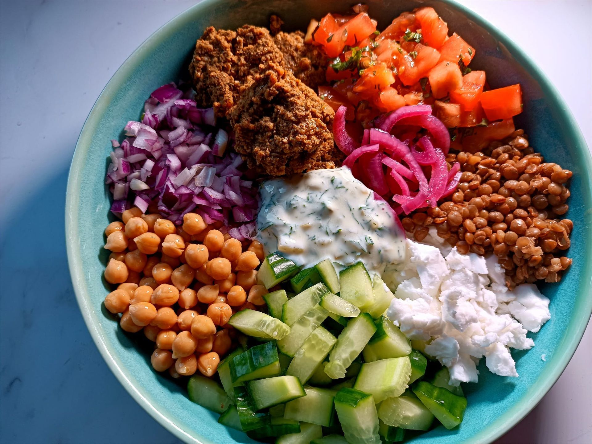 greek buddha bowl with lentils chickpeas and dill pickle dip
