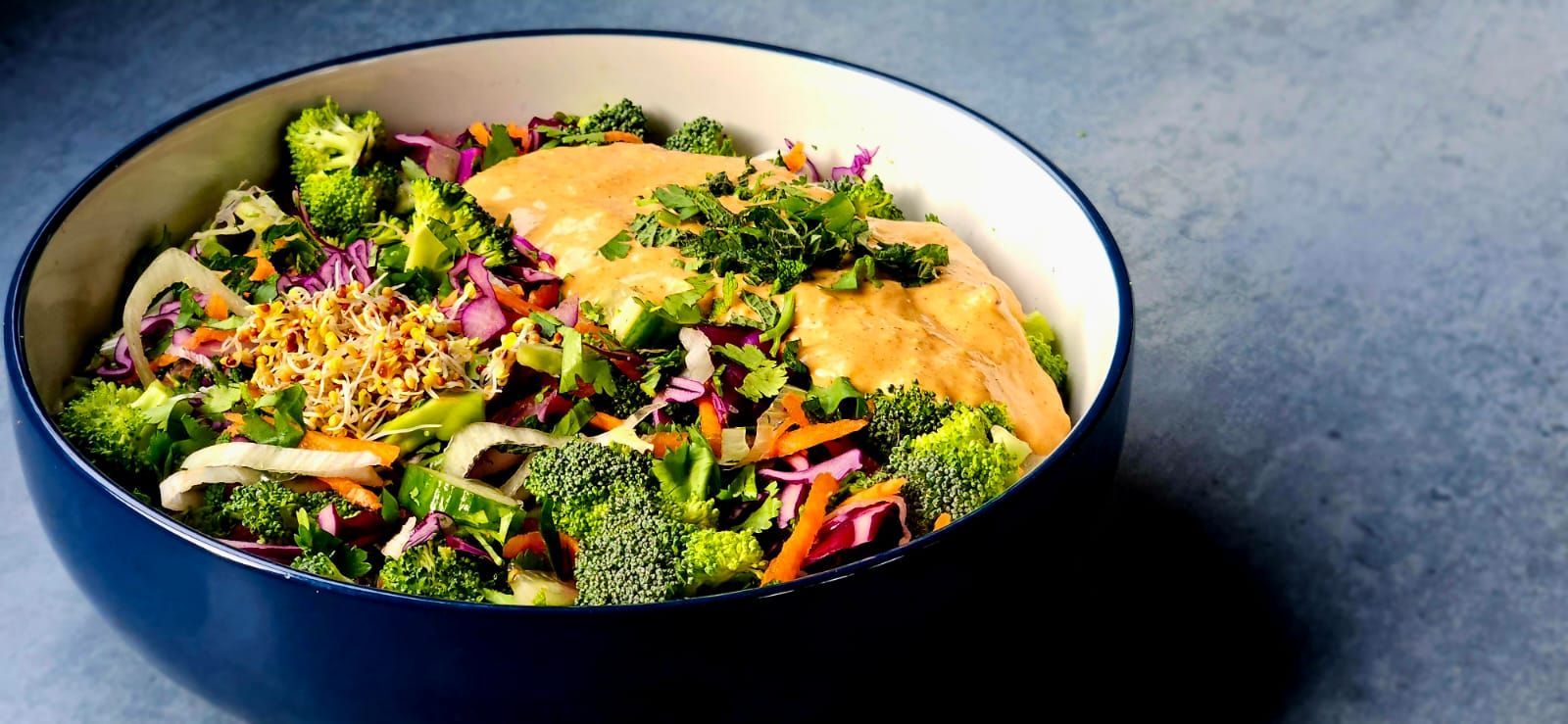 broccoli salad bowl with peanut dressing