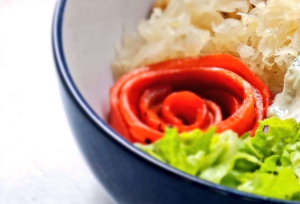 Red pepper rose in a salad bowl