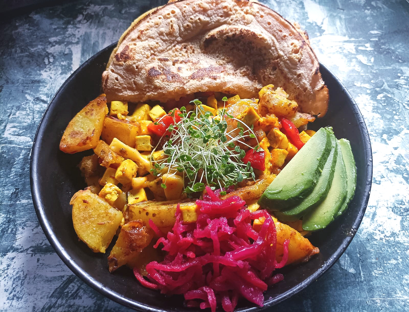 tofu hash with pink kimchi, avocado, and wrap