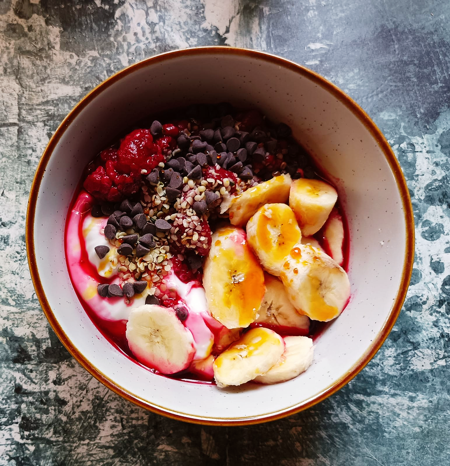 fruit in a bowl with yogurt and chocolate chips