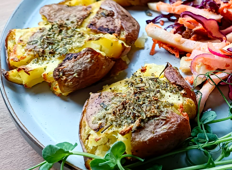Roasted potatoes on a plate with slaw