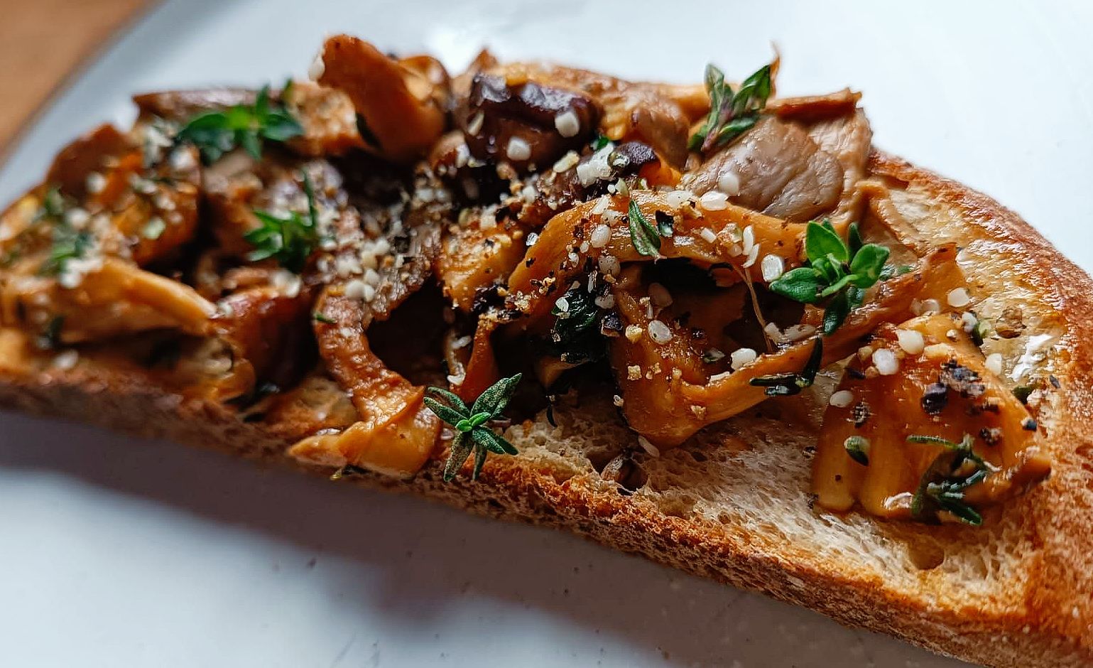 mushrooms on toast with hemp seeds and thyme
