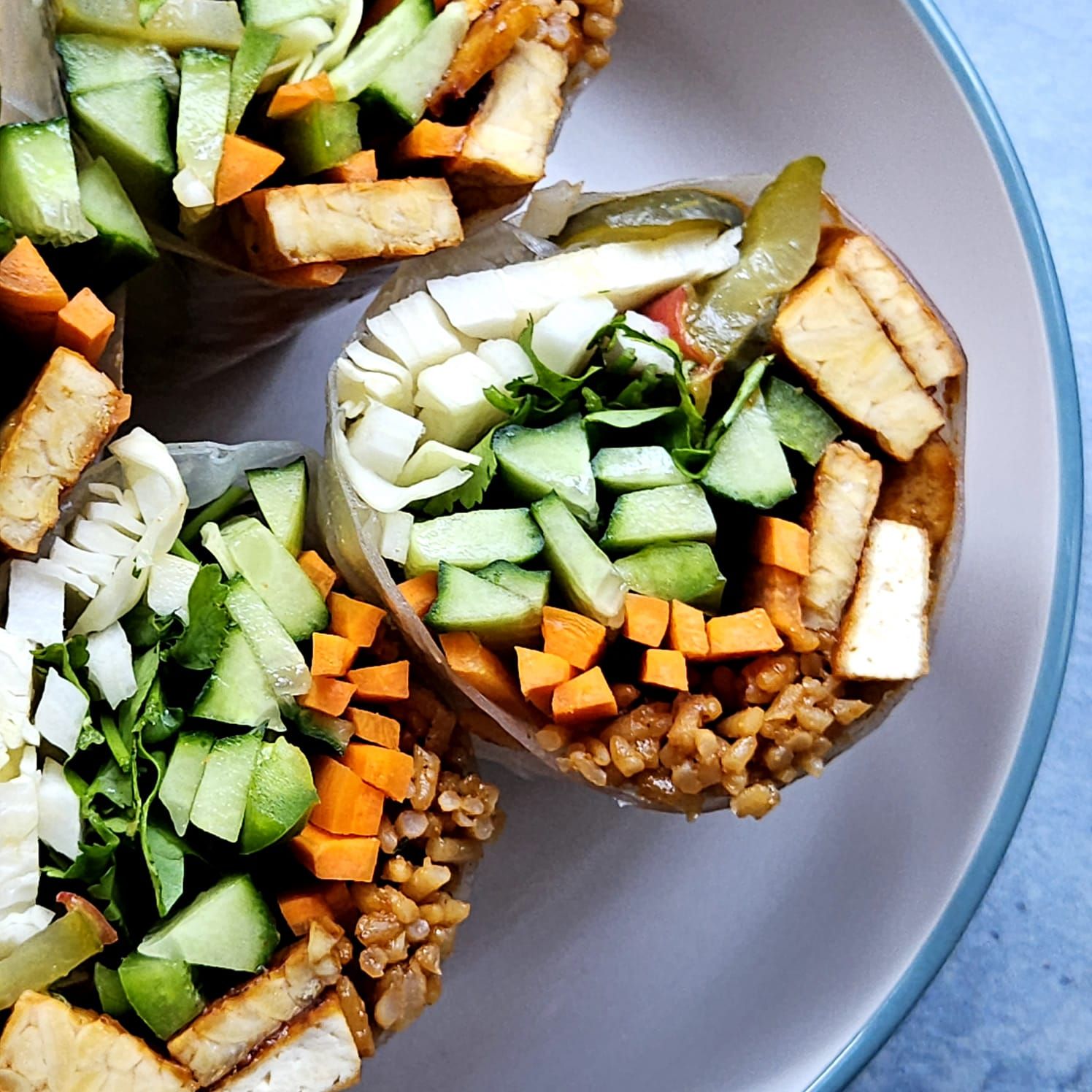 korean summer rolls with tempeh, carrot, cucumber, pickles and bbq rice