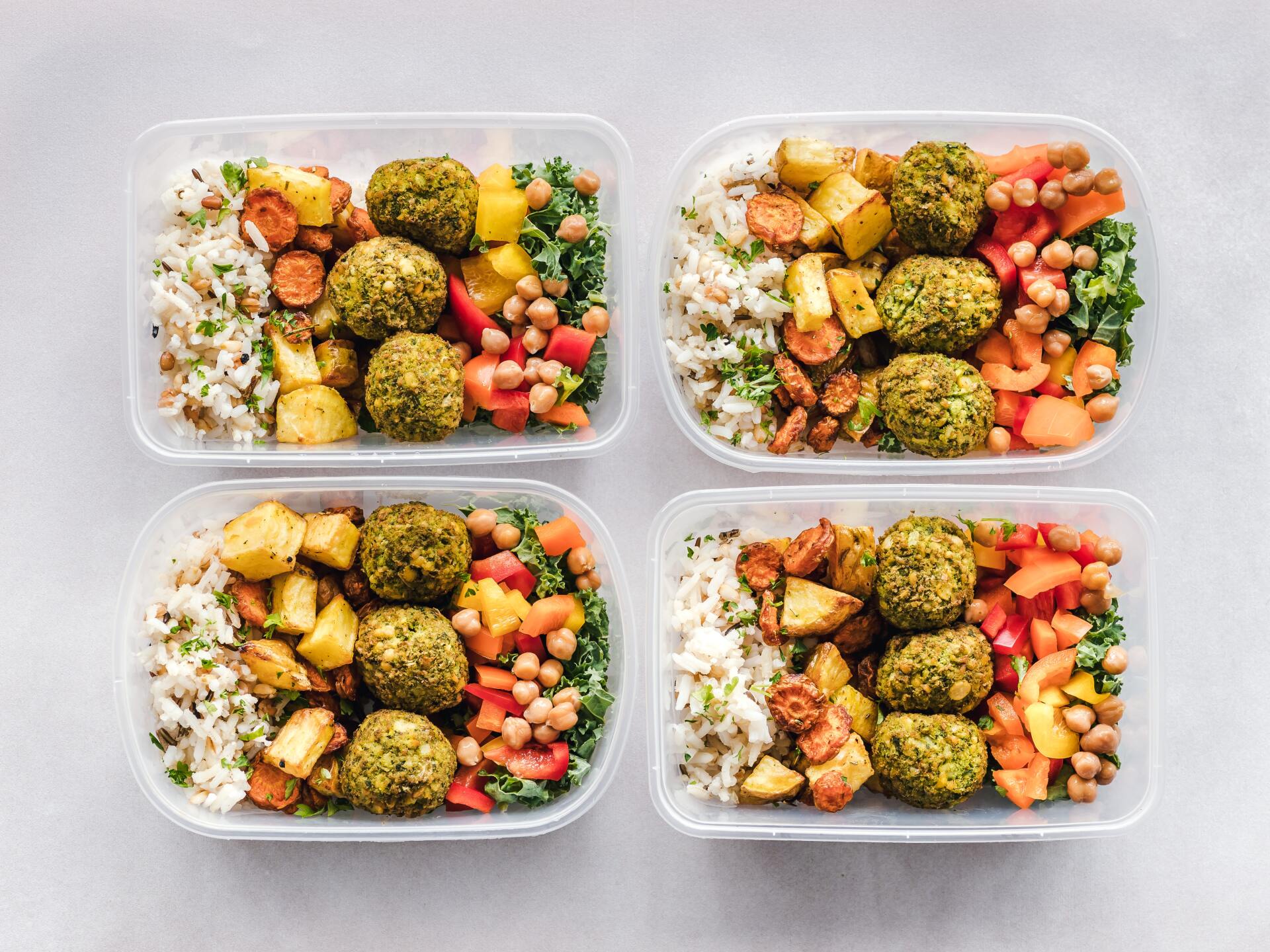 vegan meal prepped falafel salad in four containers