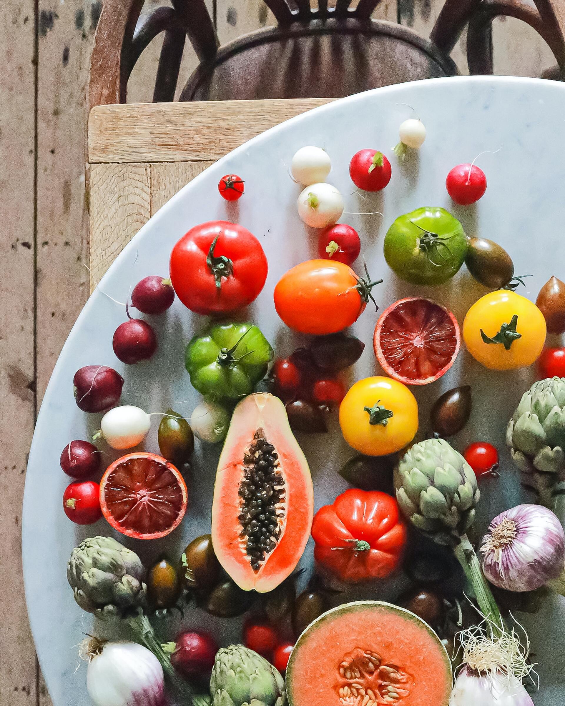 a table with a variety of fresh fruits and vegetables
