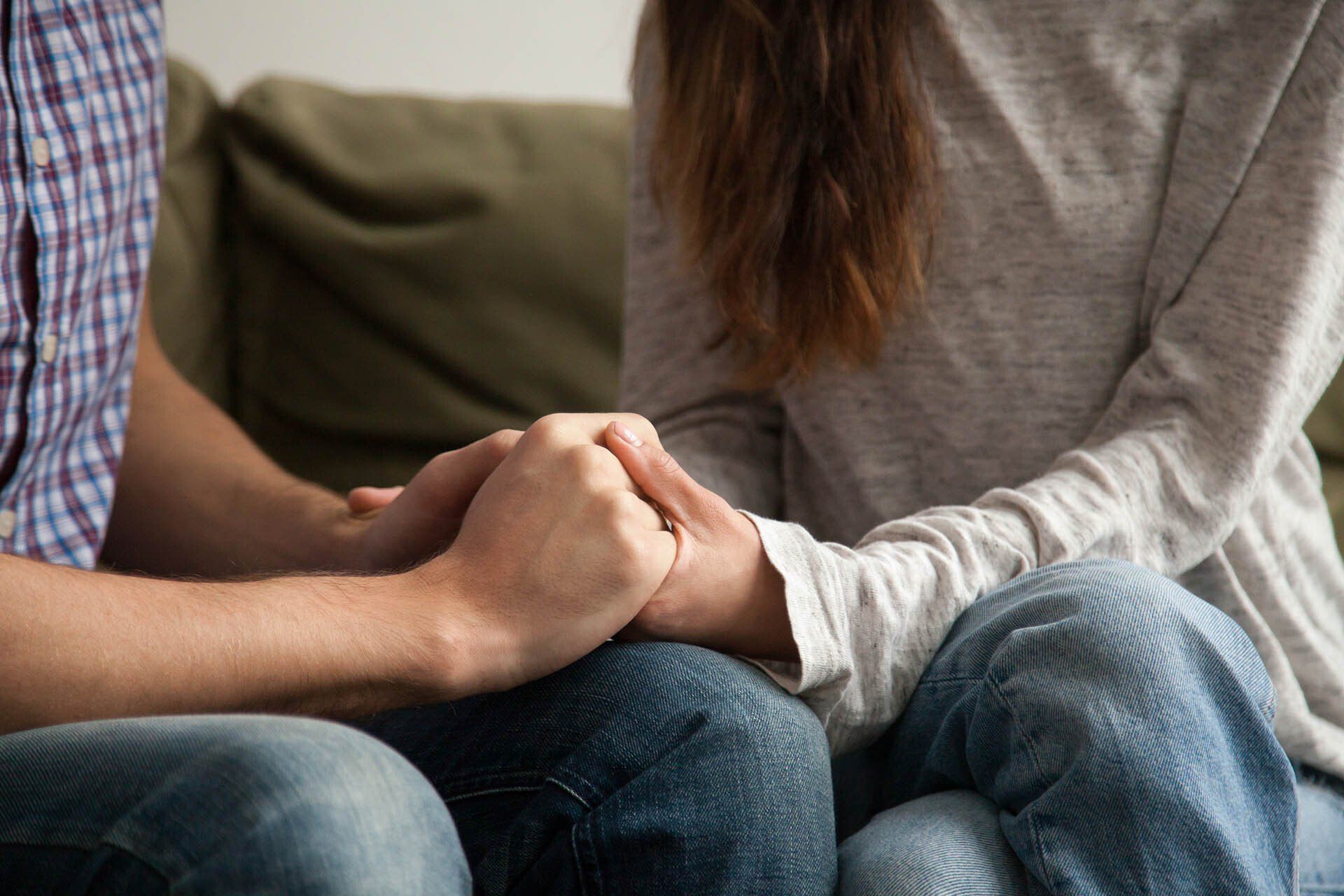 man and woman holding hands