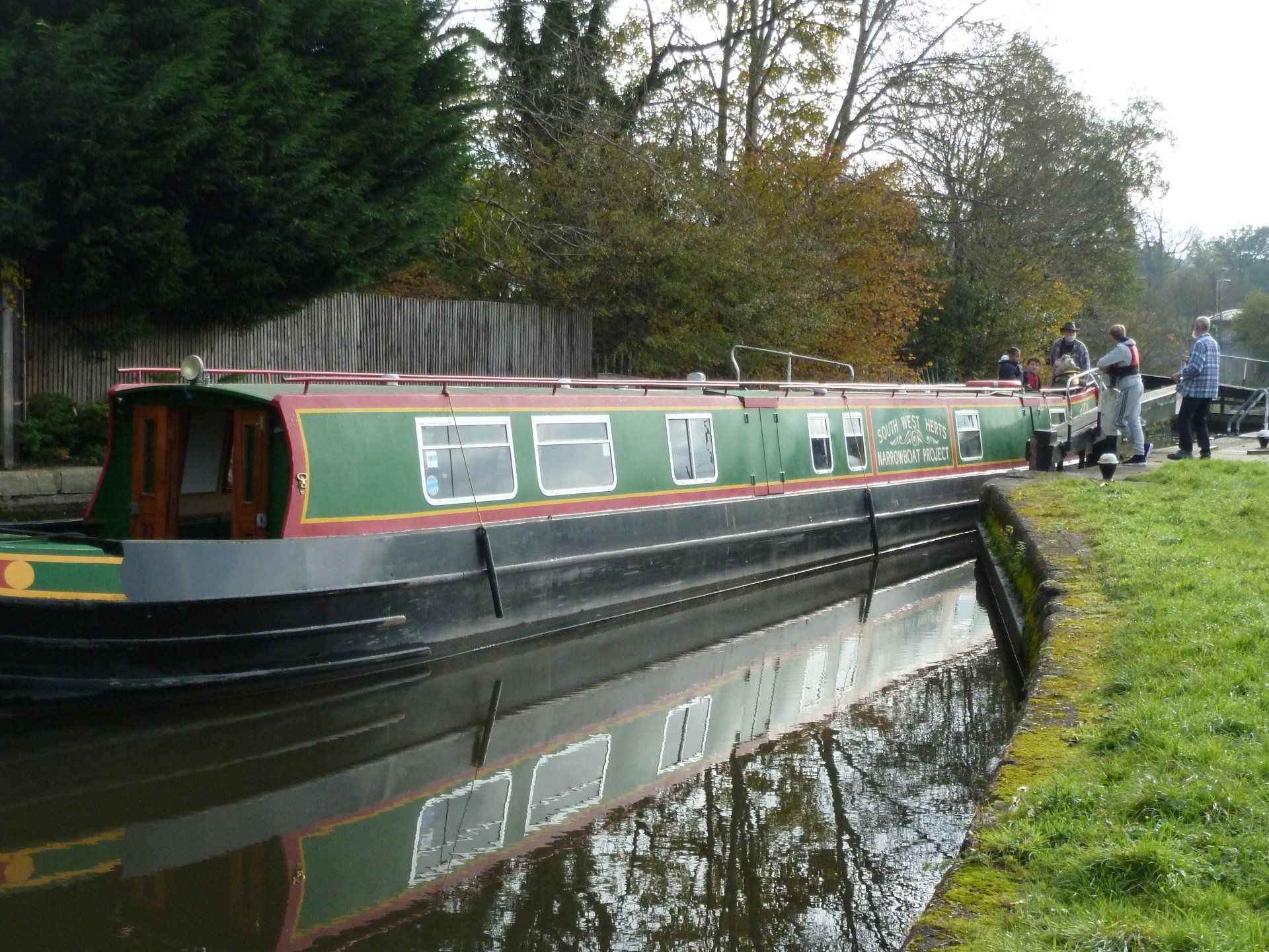 Trainees taking Dick's Folly through a lock.