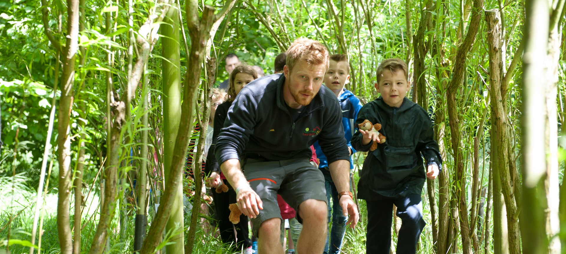 Children on a bear hunt at Nell Bank Outdoor Education Centre near Bradford
