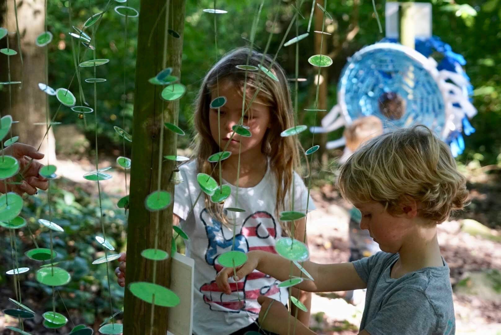 Picture of two young children exploring the outdoors at outdoor education centre Nell Bank