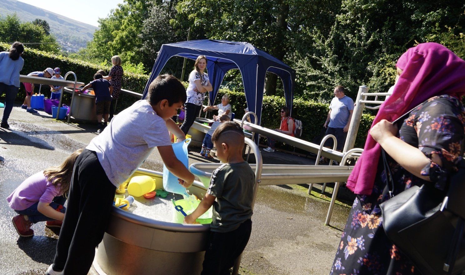 a picture ofchildren enjoying waterplay at Nell Bank outdoor education centre